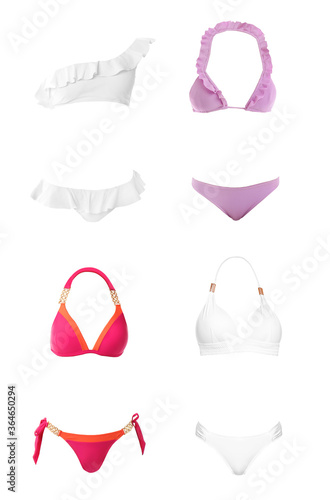 Set of different stylish bikinis on white background