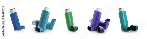 Set with portable asthma inhalers on white background. Banner design photo