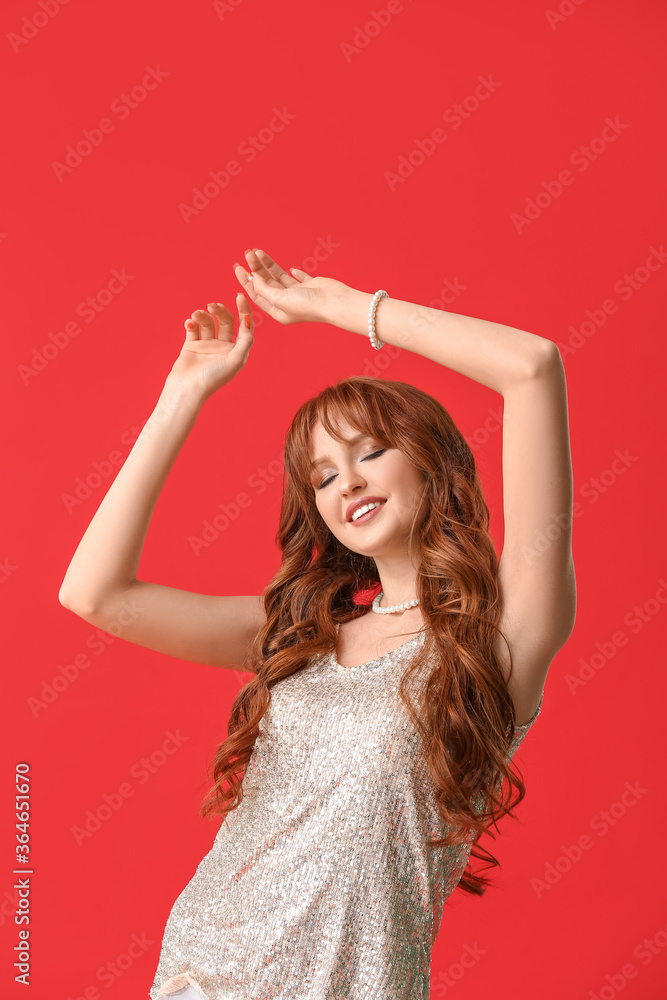 Beautiful young redhead woman on color background Beautiful young redhead woman on color background