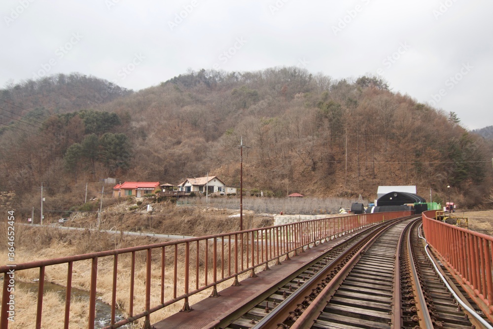 Gangchon Rail Park, Chuncheon, South Korea - 15 February 2019: The rail cart for visitors to ride along old railroad tracks in the theme park. Gangchon Rail Park, Chuncheon, South Korea - 15 February 2019: The rail cart for visitors to ride along old railroad tracks in the theme park.