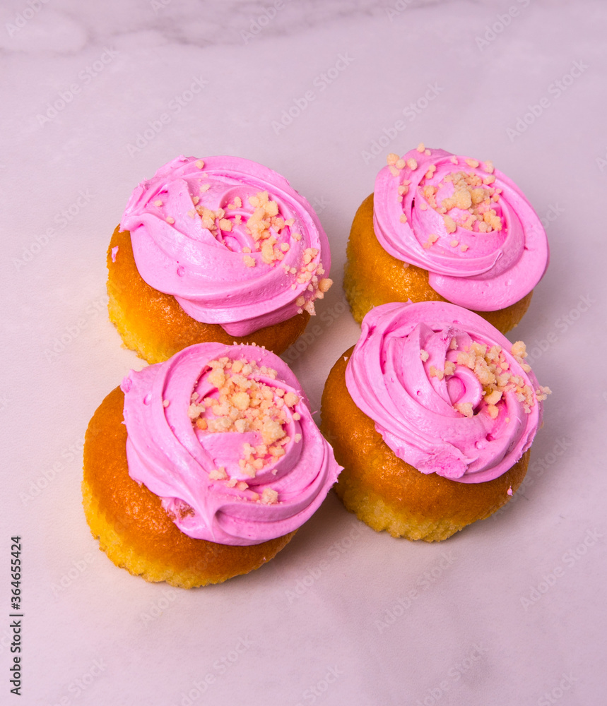 Beautiful pink cupcakes, cakes, on a light background, close-up