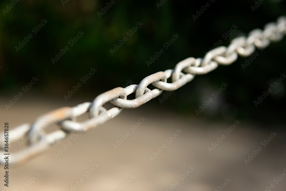old rusty chain with blur background , selected focus old rusty chain with blur background , selected focus