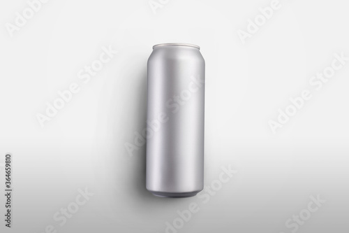 Mockup blank carbonate can with a refreshing drink lying on a white background, aluminum bottle with beer or juice, for presentation of design, pattern.