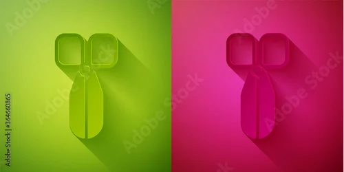 Naklejka Paper cut Scissors icon isolated on green and pink background. Cutting tool sign. Paper art style. Vector Illustration.