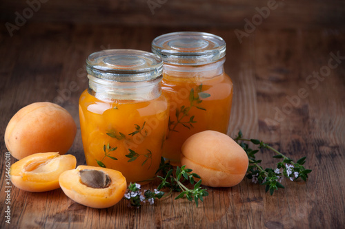 Apricot jam with thyme  in glass jars