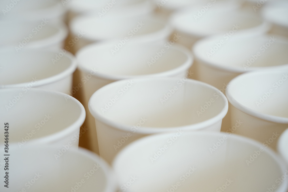 Coffee paper cups in a row. Background coffee to go. Coffee paper cups in a row. Background coffee to go.