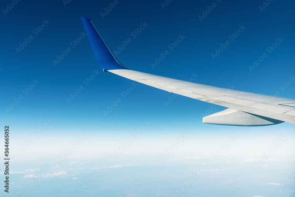A panoramic top view from an airplan of the beautiful blue sky with clouds. Banner, wallpaper concept. A panoramic top view from an airplan of the beautiful blue sky with clouds. Banner, wallpaper concept.
