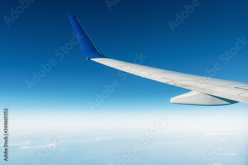 A panoramic top view from an airplan of the beautiful blue sky with clouds. Banner, wallpaper concept.