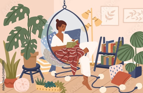 Relaxed black skin woman sitting in comfy hanging chair vector flat illustration. Female covering plaid reading book at cozy home interior. Time for yourself and relaxation at comfortable atmosphere