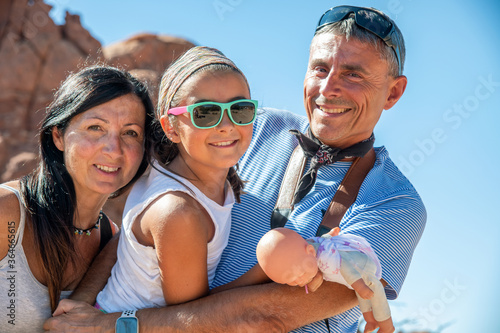 Family of three people happy visiting US National Park in summertime