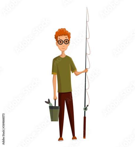 Young man with glasses, fishing rod and a bucket in his hands. Caught fish in a bucket. Successful fishing