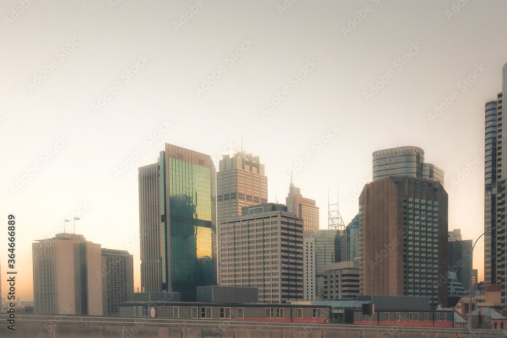 Scenic view of modern buildings in Sydney city, Australia under the sunset.