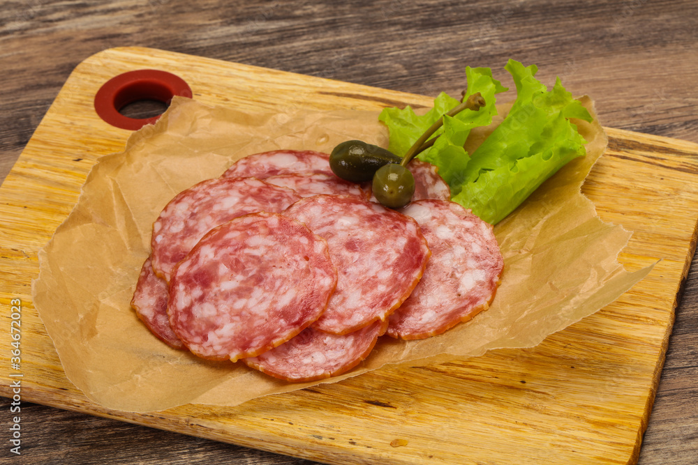 Spanish Salchichon sausage with salad Spanish Salchichon sausage with salad