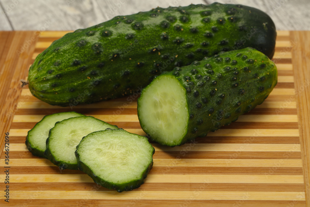 Ripe fresh green two cucumbers Ripe fresh green two cucumbers