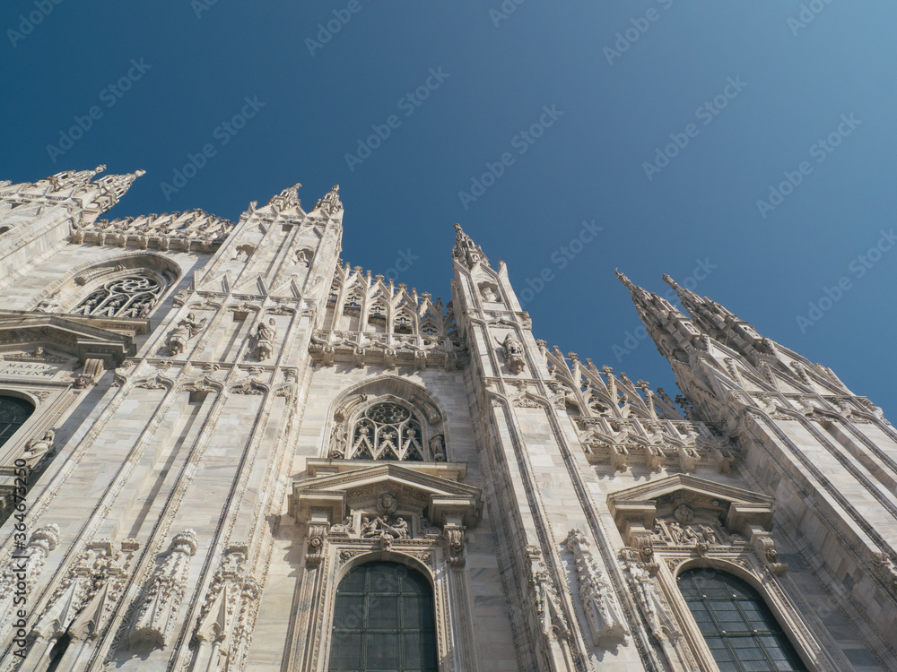 Milan cathedral spiers and blue sky