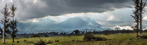 Obraz na płótnie Three volcanoes seen from Rwanda in the border area with the Democratic Republic of Congo: mounts Karisimbi, Bisoke & Mikeno (from left to right)