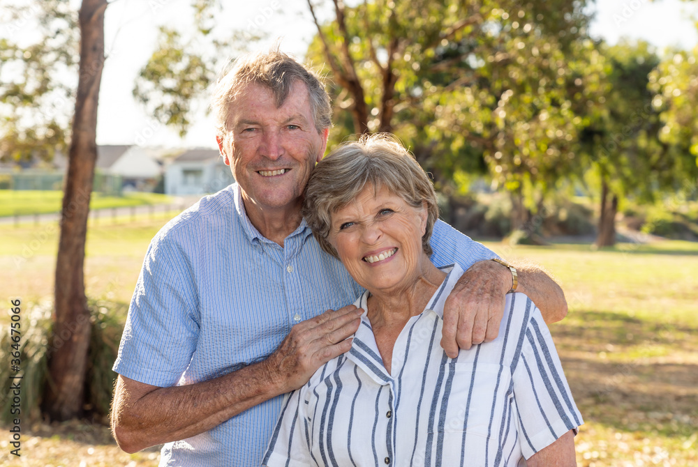 Portrait of elderly senior couple enjoying retirement lifestyle feeling happy aging together