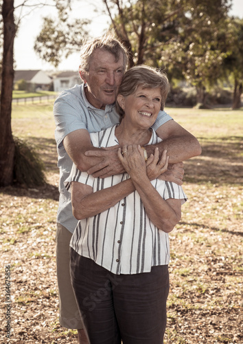Portrait of elderly senior couple enjoying retirement lifestyle feeling happy aging together © SB Arts Media