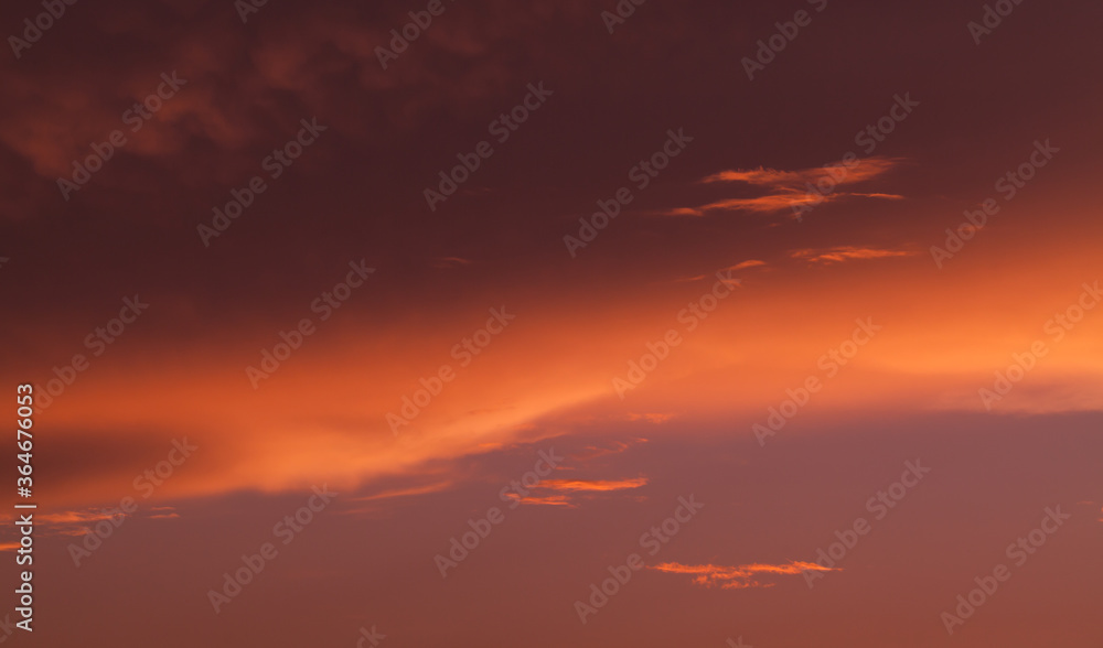 Cloudy tropical sky at sunset, natural background