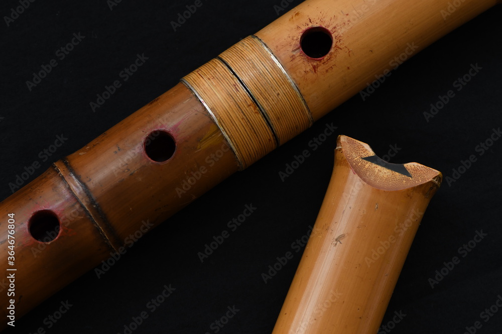 Naklejka premium Shakuhachi flute, Shakuhachi is Japanese bamboo flute, on black background.