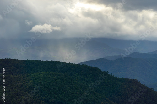 Landscape of Distant mountain range and layer in morning sun ray and white fog at the valleys  Chiang Mai in Thailand