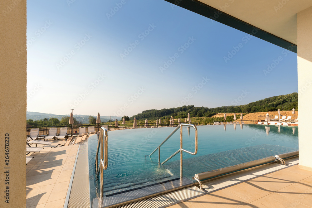 Fototapeta premium Outdoor swimming pool in a modern hotel