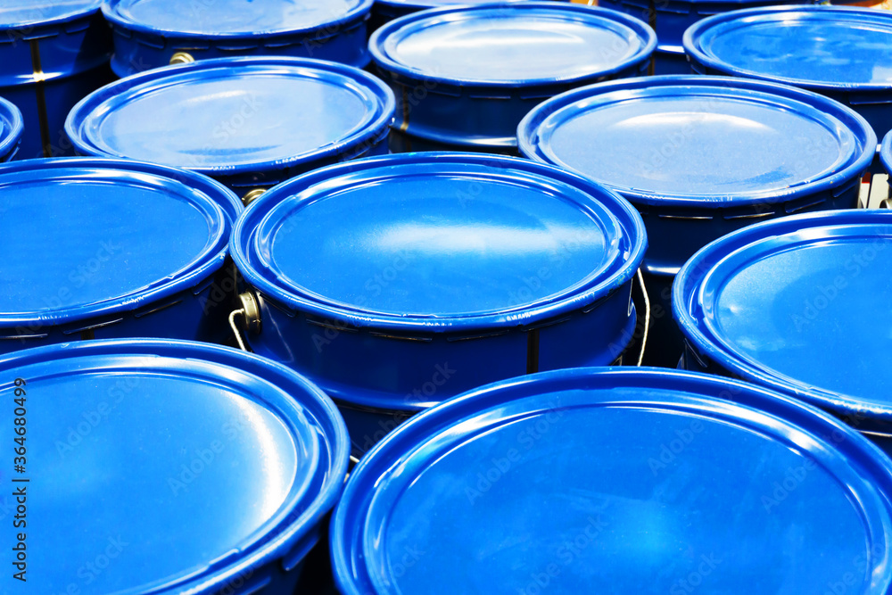 Blue metal buckets. Trade in paint in a building materials store. Blue metal buckets. Trade in paint in a building materials store.