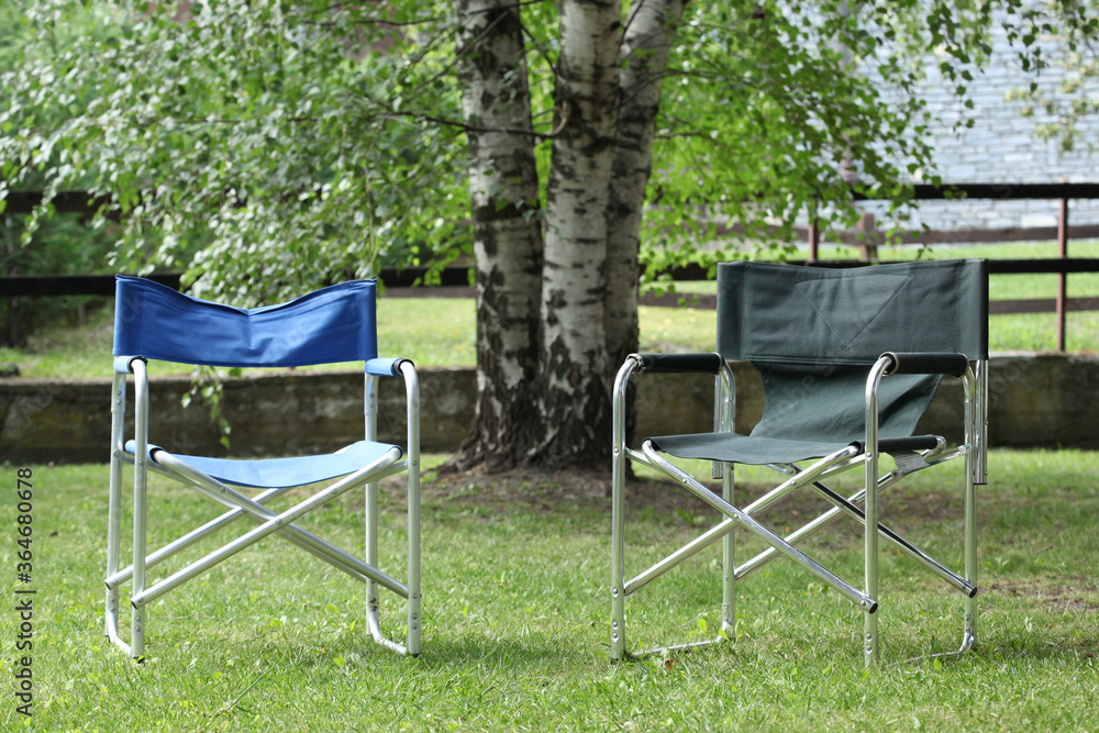 relax concept: two empty chairs in a garden at sunset with copy space for your text relax concept: two empty chairs in a garden at sunset with copy space for your text