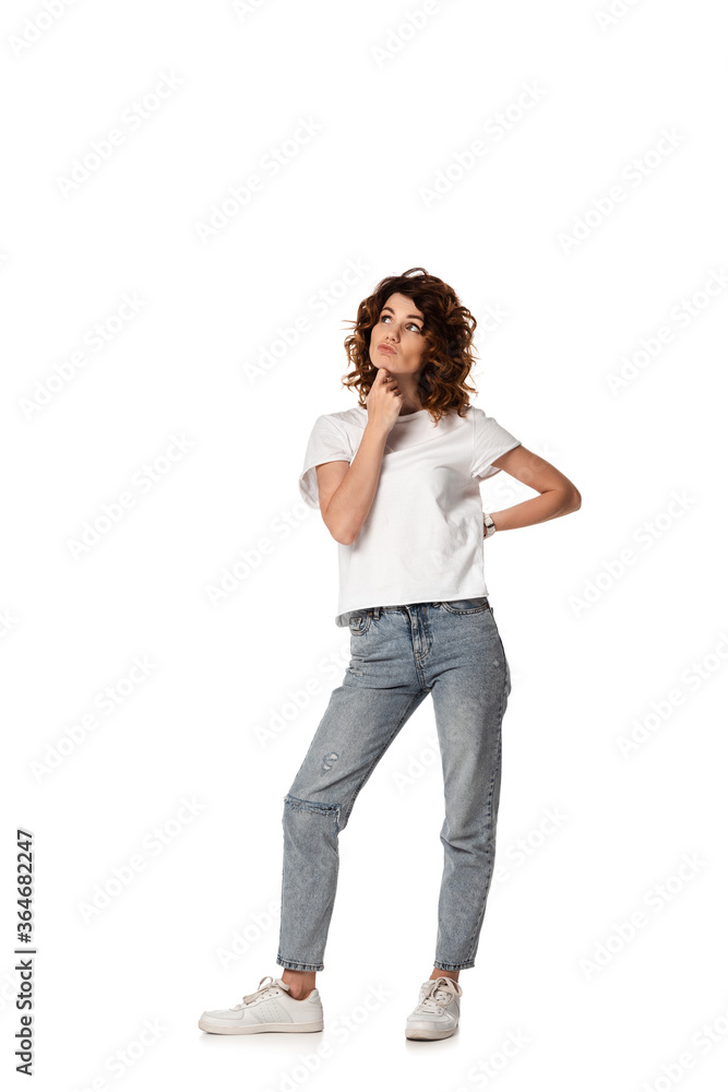 thoughtful woman looking away and touching face isolated on white thoughtful woman looking away and touching face isolated on white