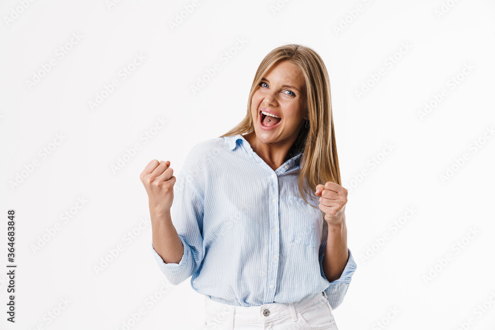 Image of excited blonde woman making winner gesture and screaming Image of excited blonde woman making winner gesture and screaming