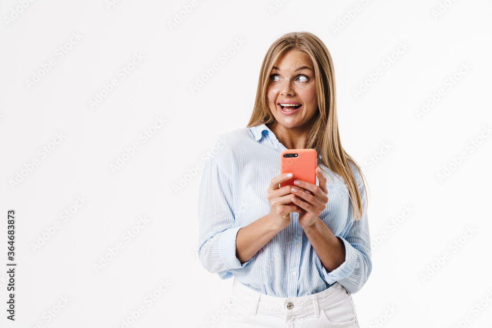Image of happy blonde woman using mobile phone and smiling Image of happy blonde woman using mobile phone and smiling