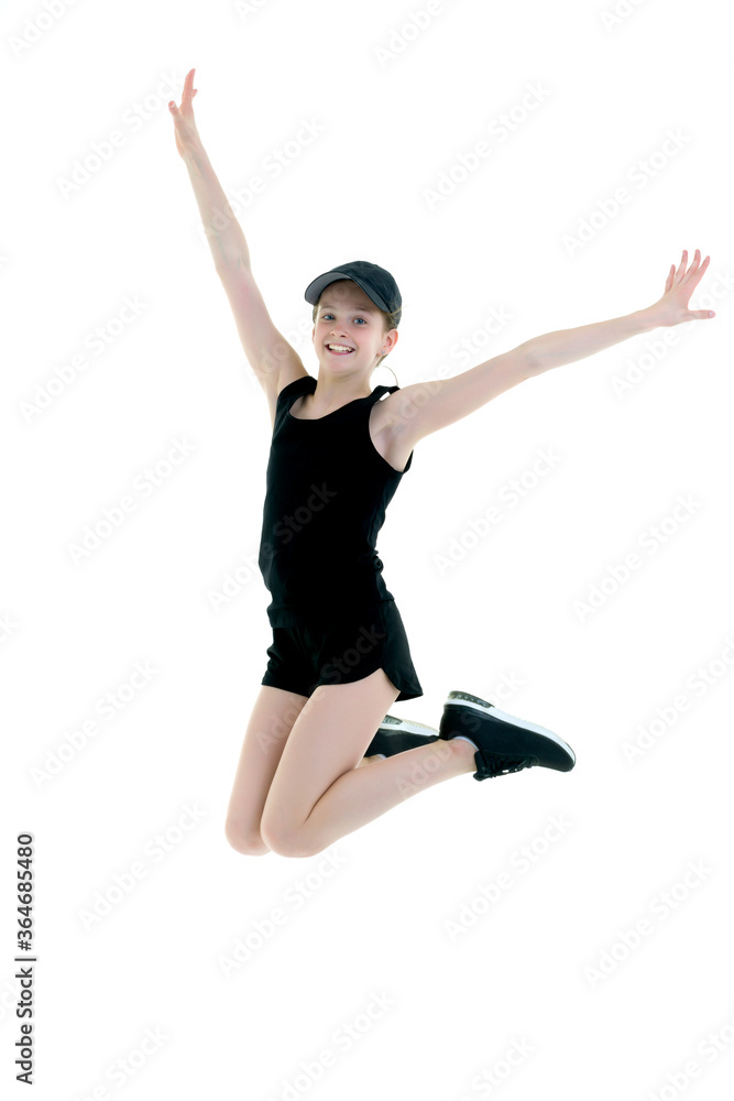 The concept of fitness, gymnastics, sports.The girl gymnast performs a jump.