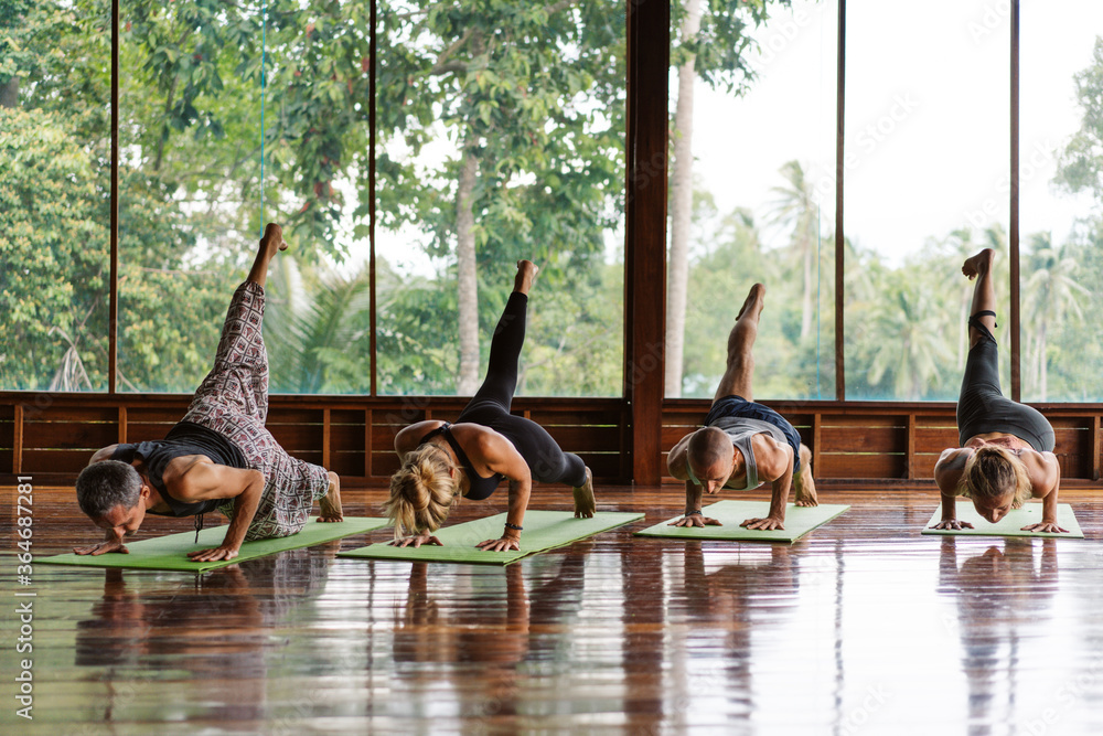 People doing yoga together at the morning