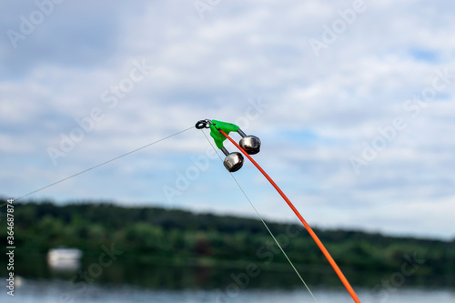 A bell on a fishing rod. Fishing tackle. River View.