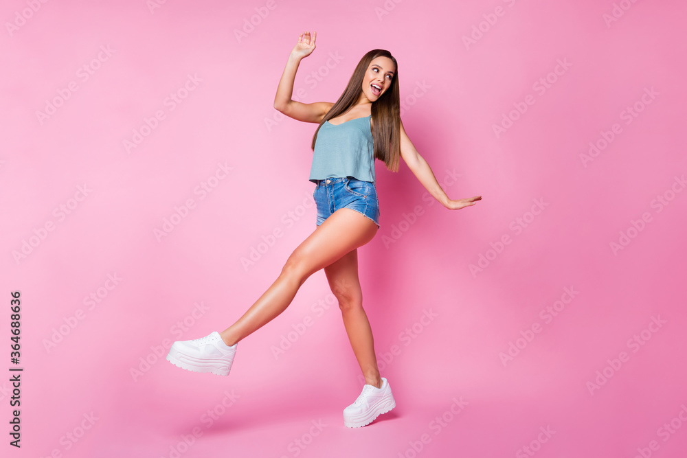 Full length body size view of nice attractive lovely charming gorgeous feminine cheerful brown-haired girl model having fun posing walking isolated over pink pastel color background Full length body size view of nice attractive lovely charming gorgeous feminine cheerful brown-haired girl model having fun posing walking isolated over pink pastel color background