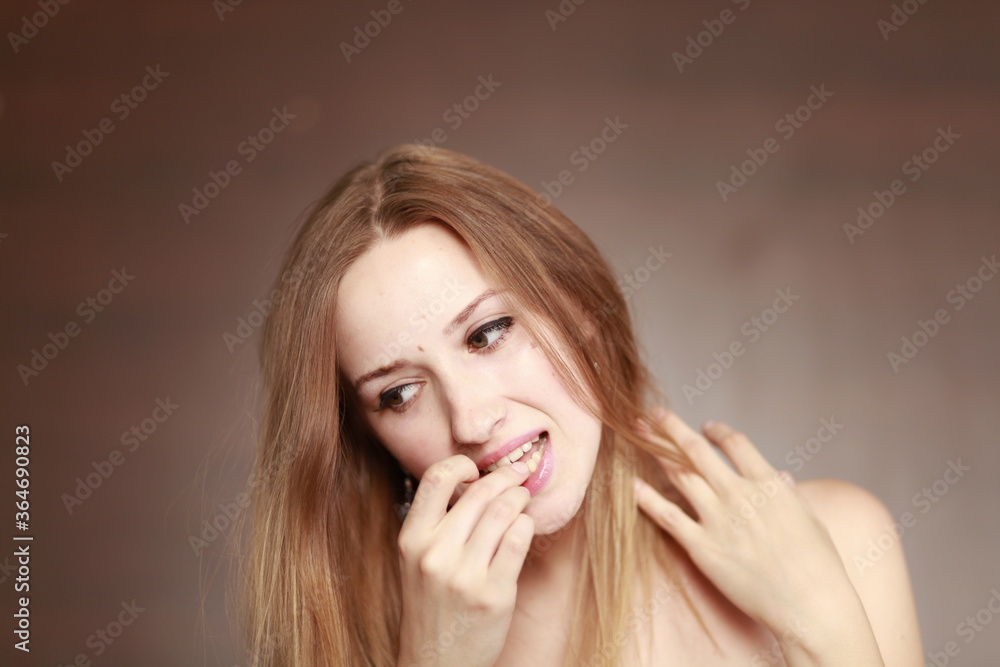 Young girl ate wrong food. Food in teeth. Hand get food from mouth. Young girl ate wrong food. Food in teeth. Hand get food from mouth.