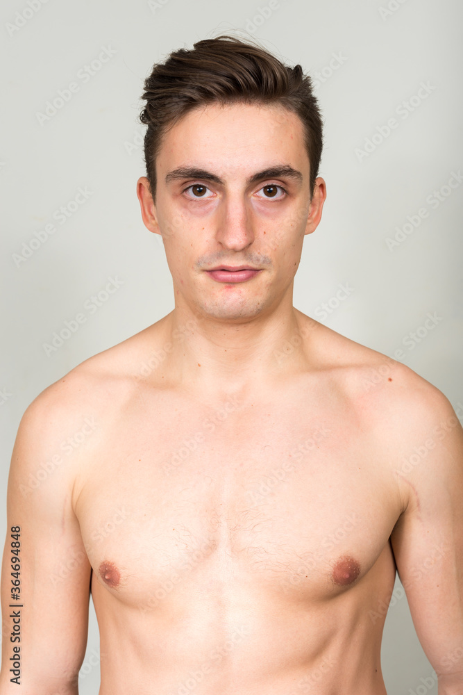 Portrait of young handsome muscular man shirtless
