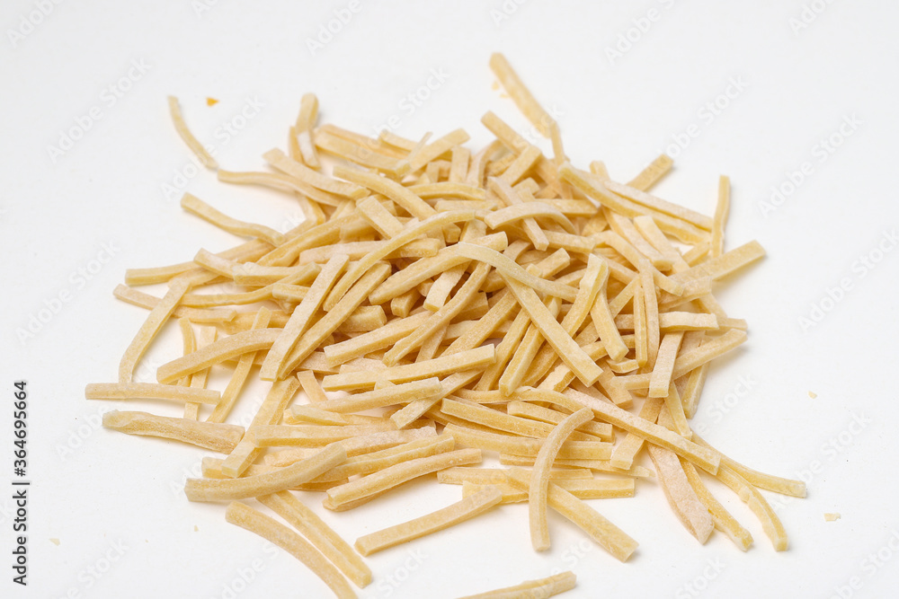 Staying at home with your family and preparing fresh home-made pasta (tagliatelle) Staying at home with your family and preparing fresh home-made pasta (tagliatelle)