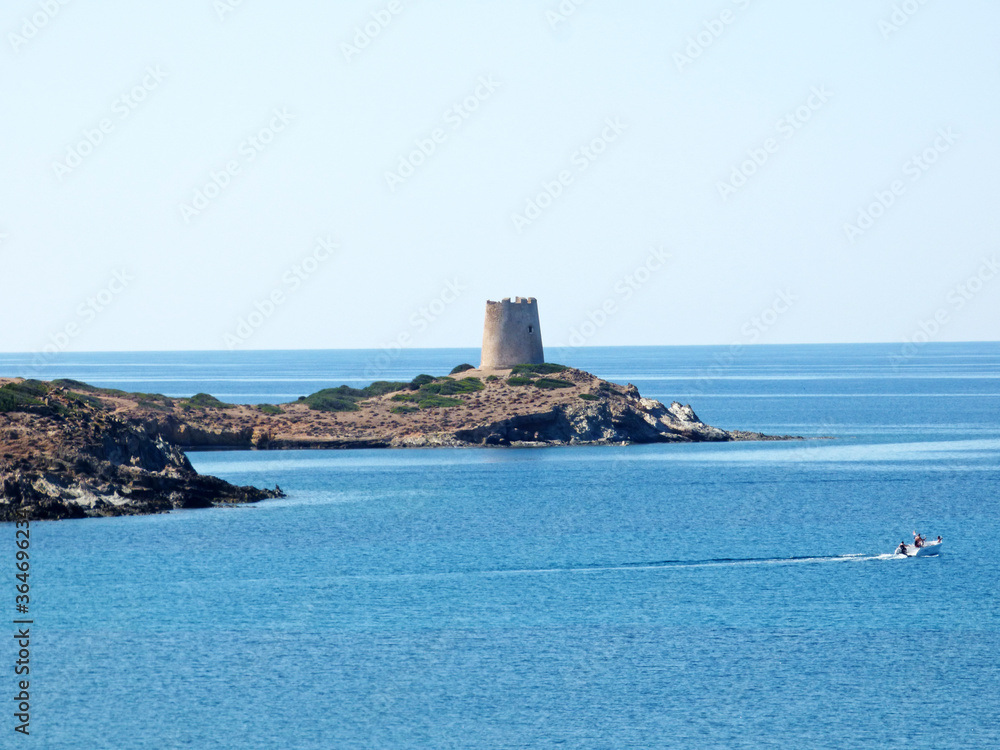 Sardinia View of the sea in front of Porto Budello, Teulada, in the background a watchtower Sardinia View of the sea in front of Porto Budello, Teulada, in the background a watchtower