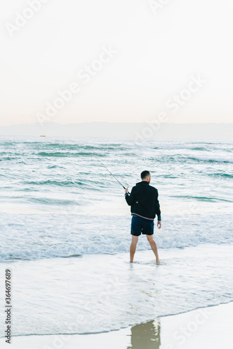 man on the palm beach Australia fishing