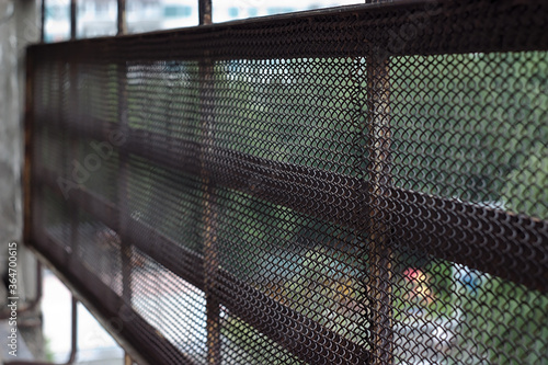 balcony fence made of rusty metal mesh