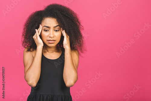 Nervous african woman breathing calming down relieving headache or managing stress, black girl feeling stressed massaging temples exhaling isolated on pink background.