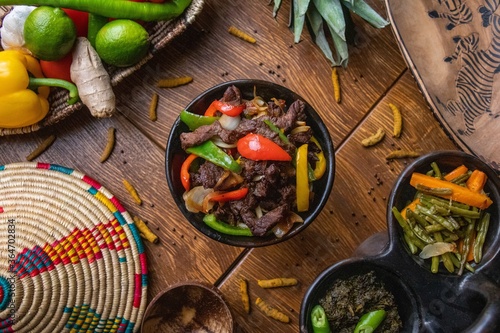 Obraz na plátně High angle shot of delicious traditional Ethiopian food with vegetables on a woo