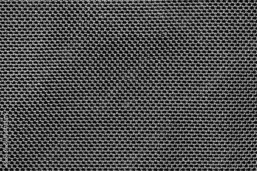 Gray knitted cotton fabric with cells pattern texture background.