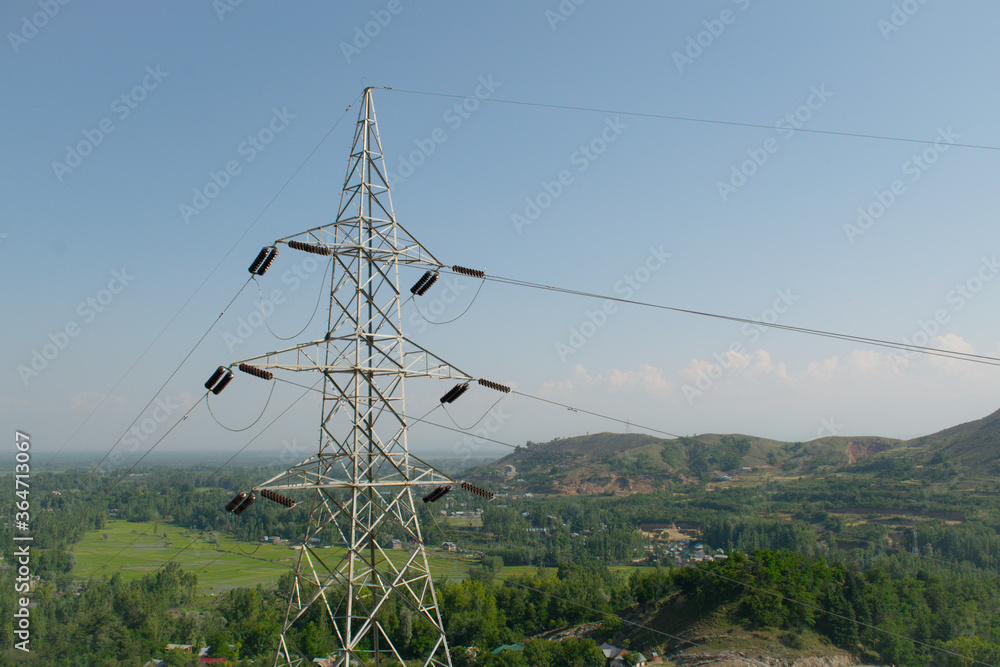 transmission tower for supplying electricity to remote areas in the forest.