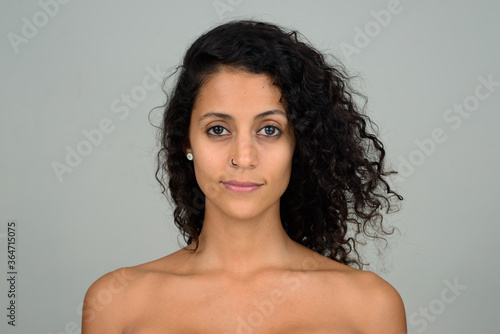 Portrait of young beautiful Hispanic woman shirtless
