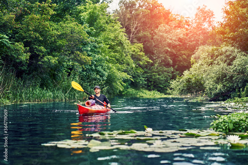 Happy best friends having fun on a kayaks. Kayaking on the river. © 6okean