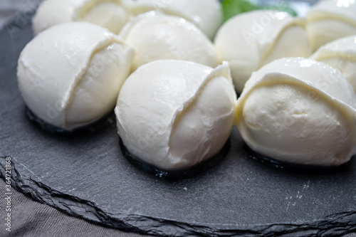 Tasty italian food, fresh white buffalo mozzarella soft cheese balls from Campania