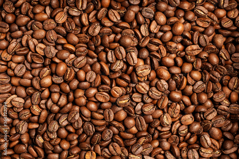 Obraz premium Background coffee beans. Pattern of brown roasted coffee bean beans