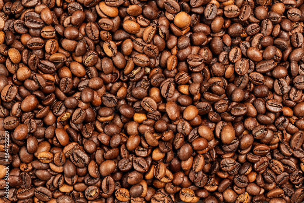 Obraz premium Tło ziaren kawy. Wzór brązowy palonych ziaren kawy
